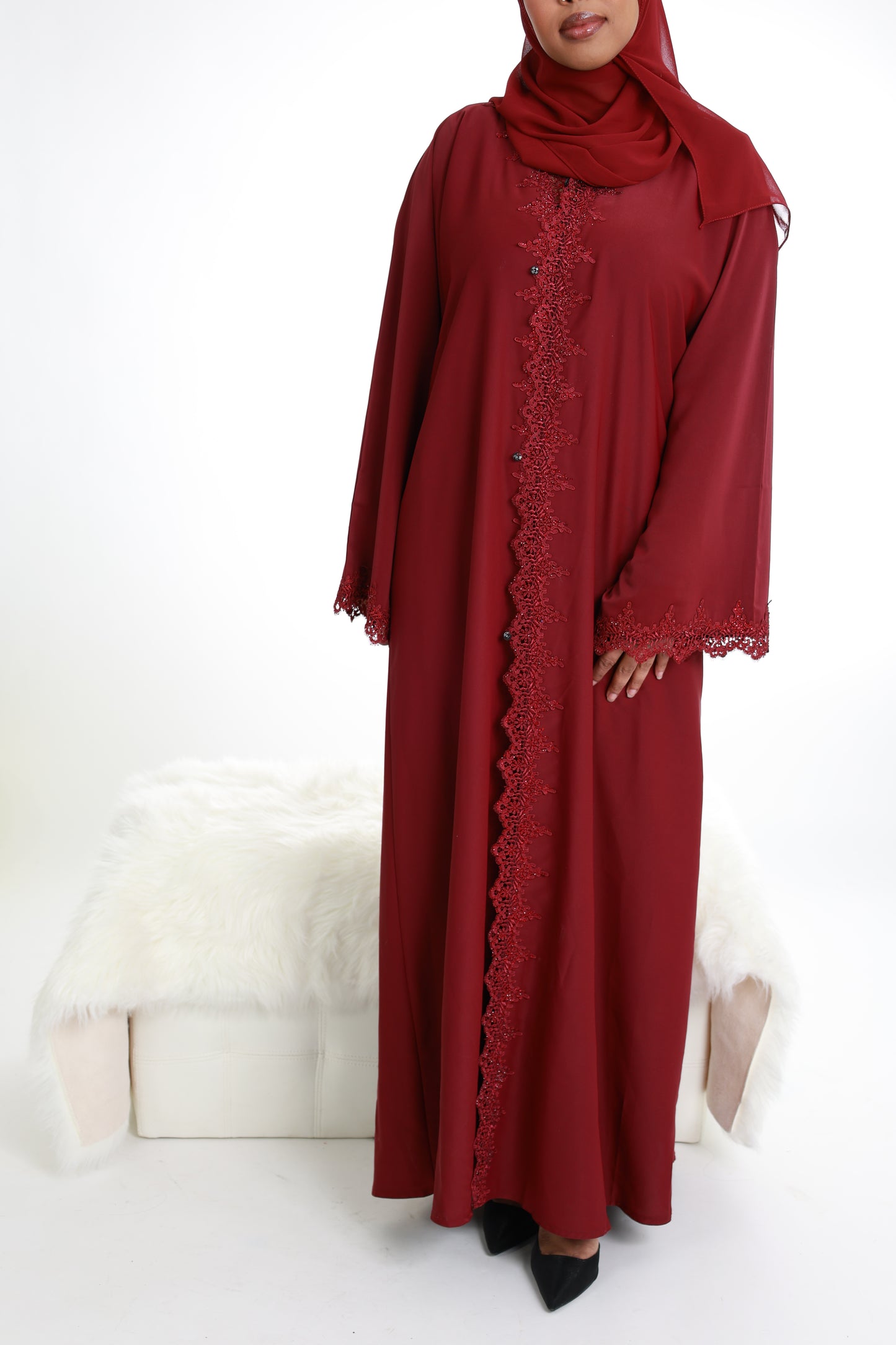 Red with lace detailing along with front and sleeves