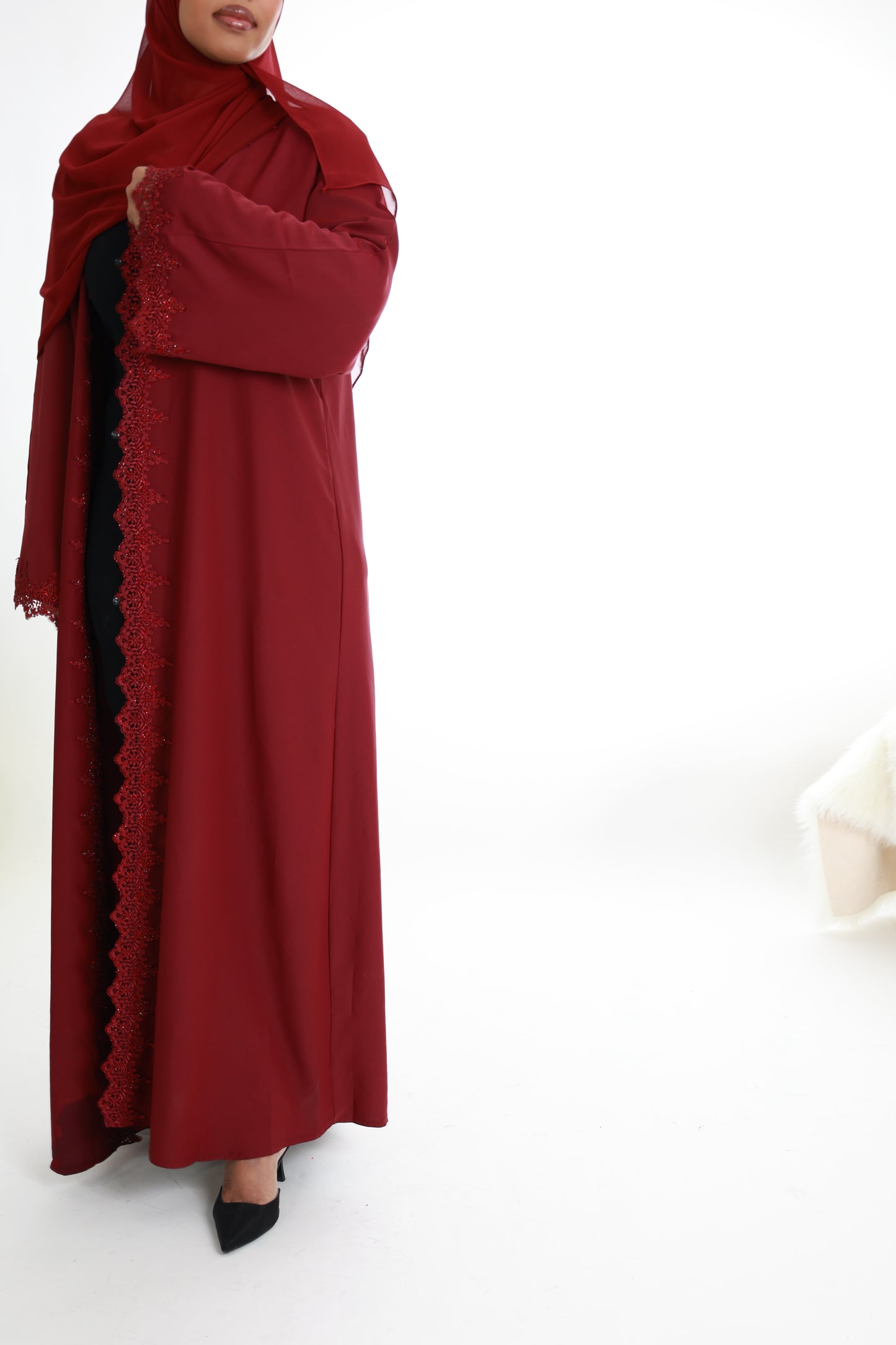 Red with lace detailing along with front and sleeves
