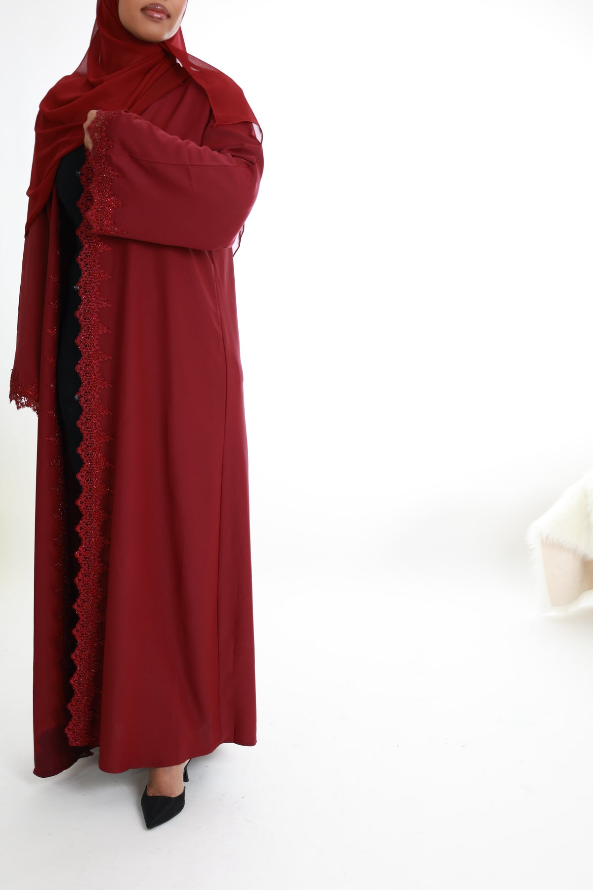 Red with lace detailing along with front and sleeves